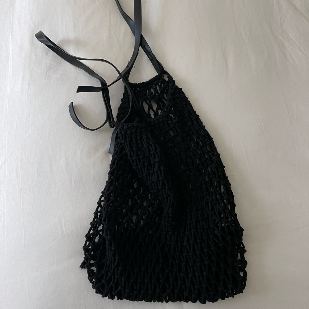 Net purse with leather handle. Never used.